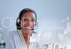 Delighted businesswoman using headset at her desk