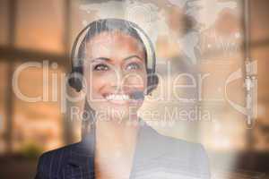 Beautiful ethnic businesswoman with a headset on looking upwards