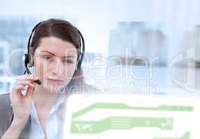 Concentrated businesswoman working on her laptop while calling