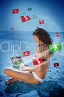 Brunette woman in bikini gambling online in blue light