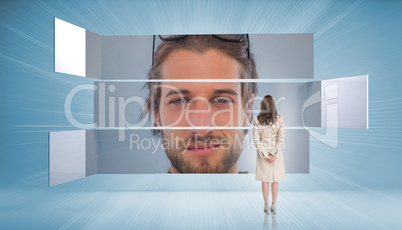 Rear view of businesswoman looking at content man