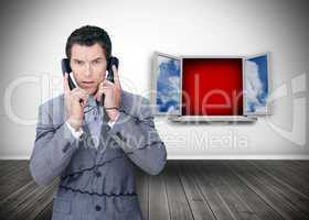 Angry businessman wrapped in cables phoning