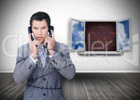 Frowning businessman wrapped in cables phoning