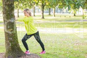 Fit attractive blonde stretching legs