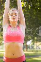 Active calm blonde doing yoga exercise