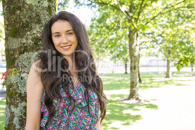 Stylish smiling brunette looking at camera