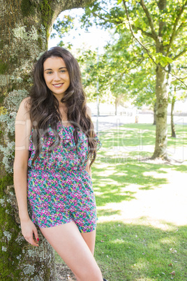 Stylish cheerful brunette looking at camera