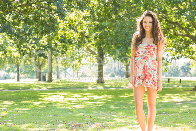 Stylish smiling brunette looking into camera