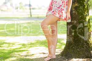 Picture of womans leg in floral dress