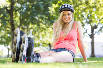 Casual cheerful blonde wearing roller blades