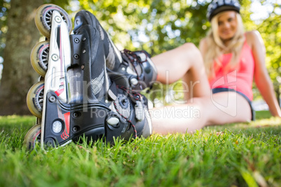 Casual attractive blonde wearing roller blades