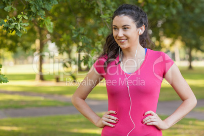 Sporty young woman posing in a park