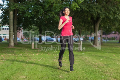 Beautiful woman running in a park
