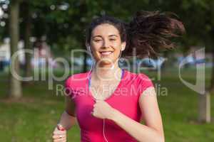 Young woman running in a park