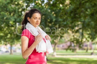 Beautiful young woman listening to music while having a break