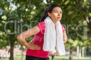 Pretty sporty woman having a break from running