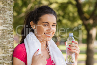 Content brunette woman having a break from running