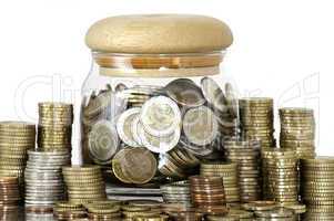 a jar full of coins on white background