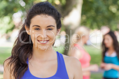 Beautiful sporty woman posing in a park