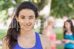 Beautiful sporty woman posing in a park