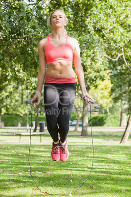 Strained blonde woman skipping