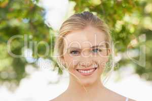 Beautiful young woman posing in a park