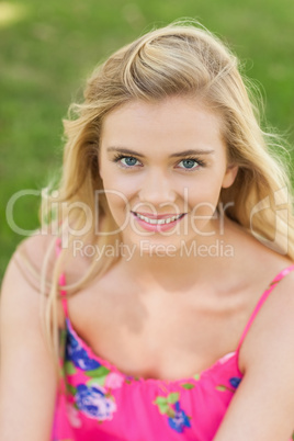 Joyful young woman smiling at camera