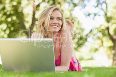 Happy attractive woman working with her notebook