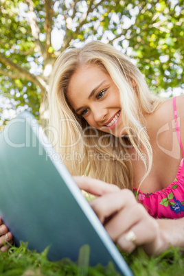 Lovely young woman using her tablet