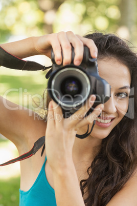 Lovely young woman taking a picture