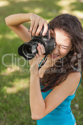 High angle view of brunette young woman taking a picture