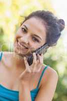 Portrait of amused young woman phoning