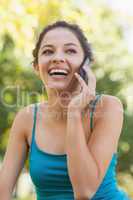 Front view of cute young woman phoning