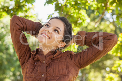 Front view of cute woman posing in a park
