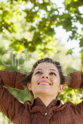 Low angle view of pretty woman posing in a park