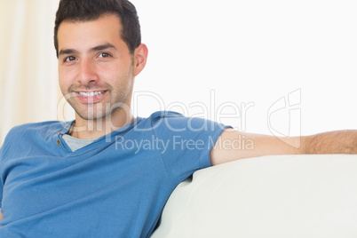 Casual attractive man relaxing on couch