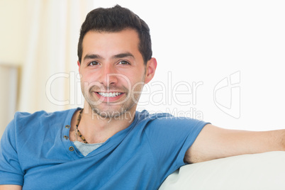 Casual good looking man relaxing on couch