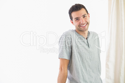 Casual cheerful man looking at camera