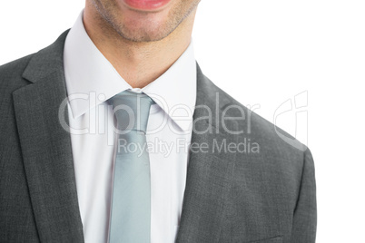 Mid section of businessman wearing blue tie