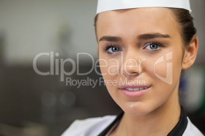 Young content chef looking at camera