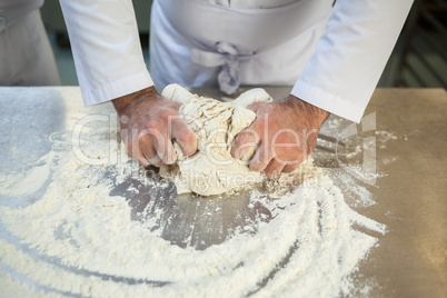 Close up of chef preparing dough