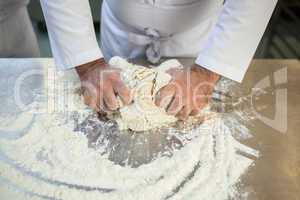 Close up of chef preparing dough