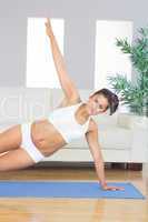 Sporty calm woman practicing yoga pose
