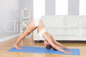 Fit slim woman practicing yoga pose for stretching her body