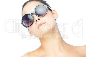 Cute brunette woman wearing gigantic sunglasses