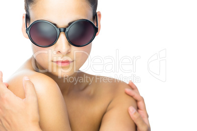 Cute brunette woman wearing round sunglasses