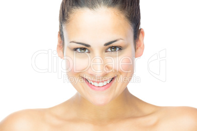 Front view of beautiful brunette woman smiling at camera