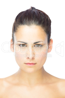 Front view of serious brunette woman looking at camera