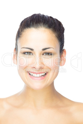 Front view of pretty young woman laughing at camera