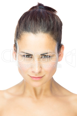 Self confident brunette woman gazing at camera